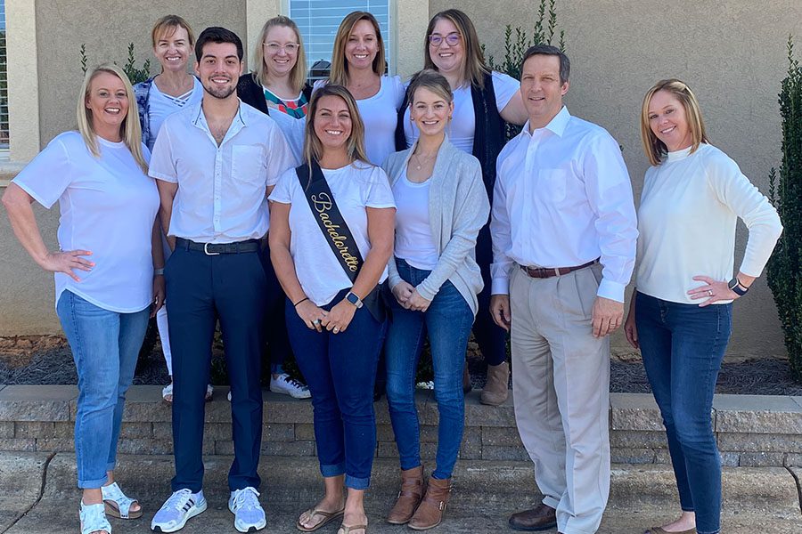 Community Involvement - Summit Insurance Group Inc Team Standing Together All Wearing White During an Event